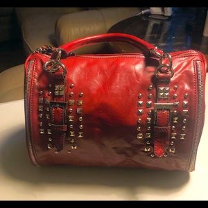 Deep Red Nine West medium sized bag with large studded accents